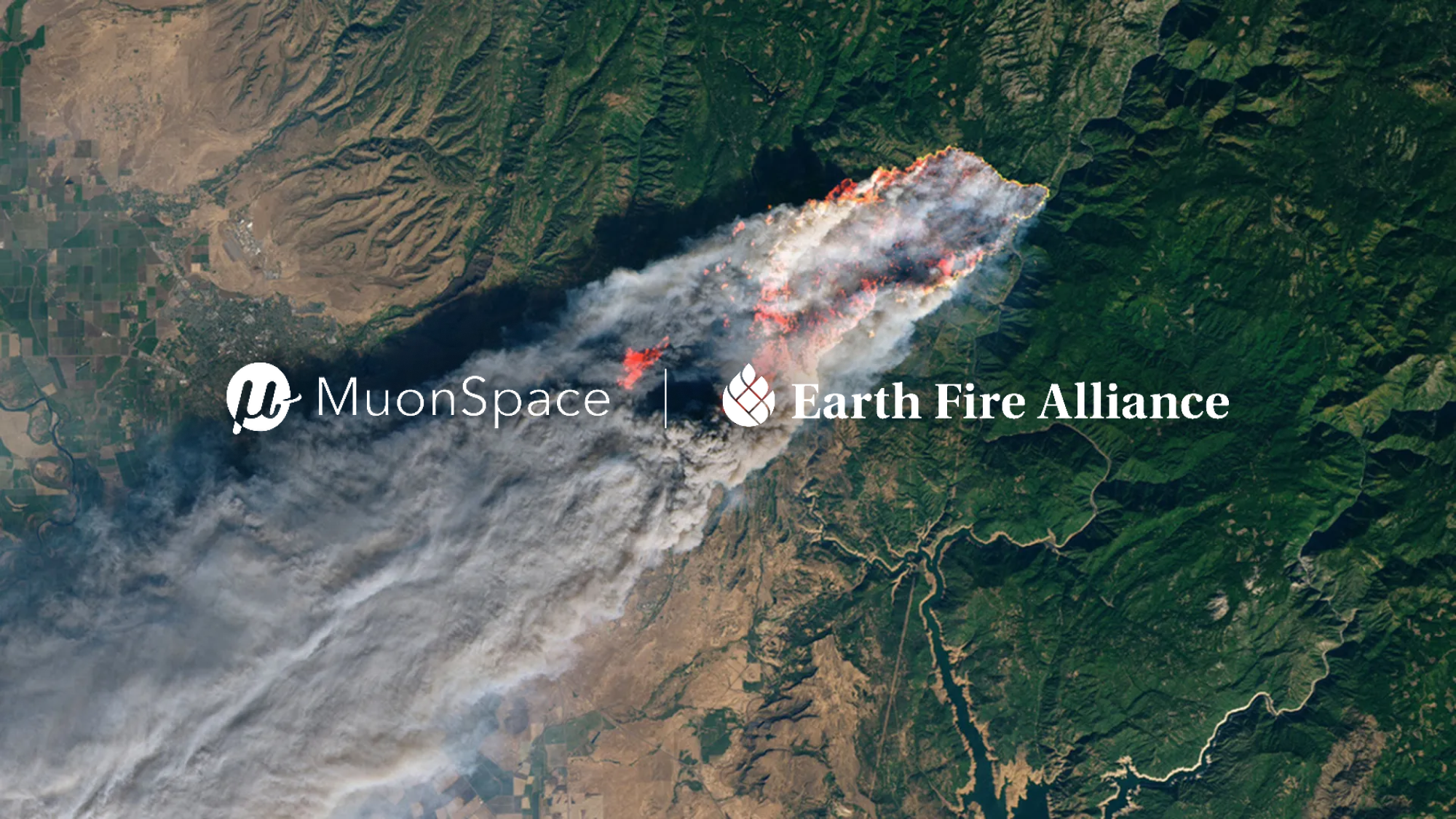 Satellite view of a large wildfire with smoke plumes over forested terrain, overlaid with Muon Space and Earth Fire Alliance